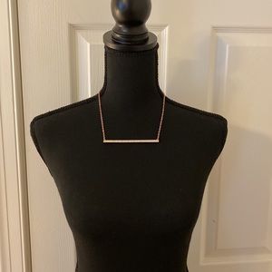 Rose gold rhinestone costume jewelry bar necklace.